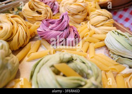 Different types of pasta displayed on a wooden tray Stock Photo