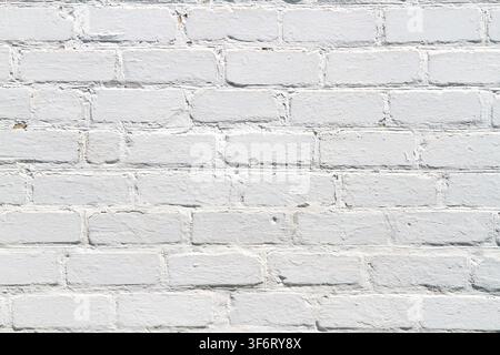 Uniform texture of light brick wall. Old whitewashed brickwork. Stock Photo