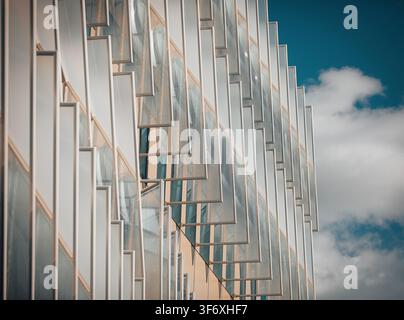 Geometric architectural facade against a blue sky Stock Photo
