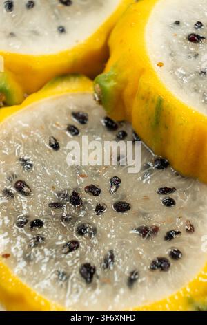 Exotic tropical fruit background with round dragon fruit pitaya slices Stock Photo