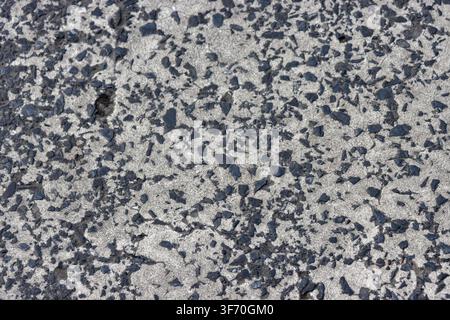 Abstract grunge texture of severe cracking on white painted road marking, pedestrian zebra crossing background Stock Photo
