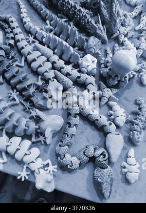 Art models printed on 3D printer. Different objects created on 3D printer from molten plastic. 3D printed different objects. Modern new modern additive progressive technologies. 3D printing technology Stock Photo