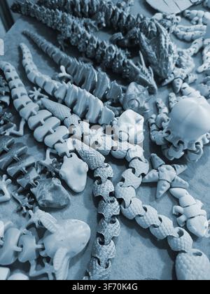 Art models printed on 3D printer. Different objects created on 3D printer from molten plastic. 3D printed different objects. Modern new modern additive progressive technologies. 3D printing technology Stock Photo