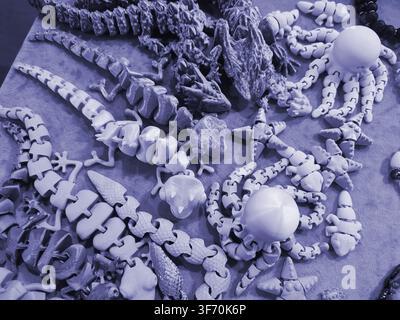 Art models printed on 3D printer. Different objects created on 3D printer from molten plastic. 3D printed different objects. Modern new modern additive progressive technologies. 3D printing technology Stock Photo