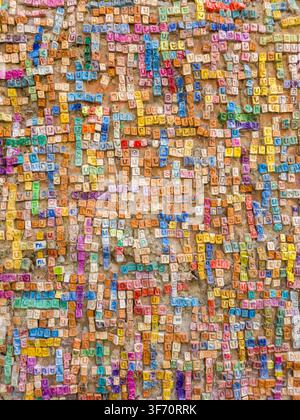 Colorful Wall of Handmade Ceramic Tiles with Close-up of a colorful wall covered with handmade ceramic letter tiles forming Armenian names in Gyumri, Stock Photo