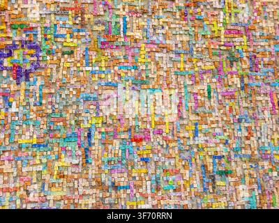 Colorful Wall of Handmade Ceramic Tiles with Close-up of a colorful wall covered with handmade ceramic letter tiles forming Armenian names in Gyumri, Stock Photo