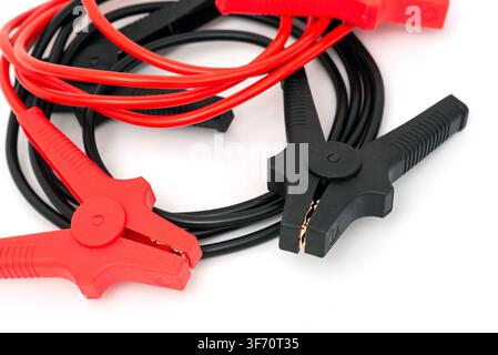 Red and black jumper cables with clamps isolated on a white background  Stock Photo