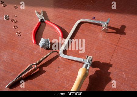 Artist's tools on work bench Stock Photo