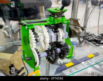 Construction mechanism of parts plastic gears printed on 3D printer. Model created on 3D printer from black white molten plastic. Creative shape printed on 3D printer. Additive3D printing technology Stock Photo