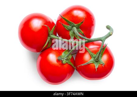 Fresh natural tomatoes on a white background. Four tomatoes isolated. Organic tomatoes. Stock Photo