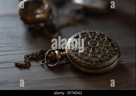 vintage watch with closed lid on the table, selective focus, bokeh Stock Photo
