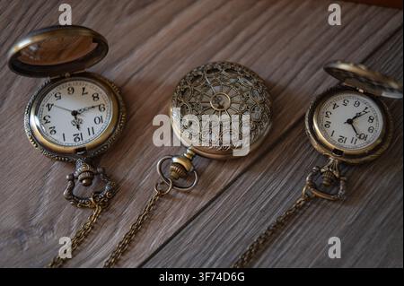 antique pocket watch with chain on dark wooden background Stock Photo