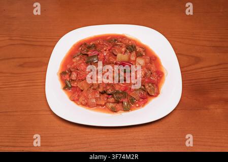 Spanish Pisto Vegetable Stew with Peppers Onions and Tomato Sauce on White Plate Stock Photo