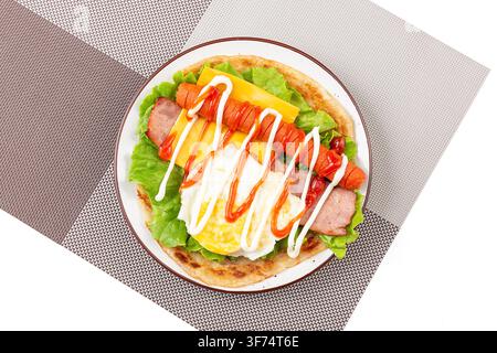Loaded Scallion Pancake Wrap With Egg Sausage Bacon Cheese Lettuce Stock Photo