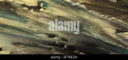 Abstract dark paint texture background with gold green and teal metallic brush strokes Stock Photo