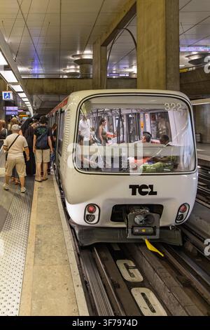 Lyon, France - 27 July 2026: Close frontal shot of driverless metro carriage 322 with passengers boarding at station platform in Lyon. Stock Photo