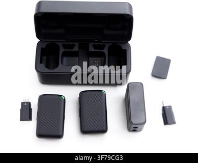 A wireless microphone system with a charging case and accessories Stock Photo