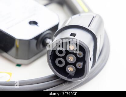 Electric vehicle charging cable with a type two connector plug Stock Photo