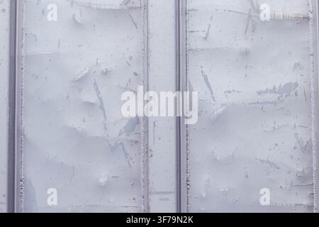 Scratchy and weathered grey painted metal texture with welded seams. Industrial background concept for construction, metallurgy, grunge design, and abstract surface. Stock Photo