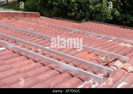 Mounting structure installed on residential roof, ready to mount solar photovoltaic or PV panels onto in Malaysia Stock Photo