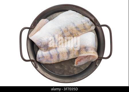 Raw pike perch fillets with skin on isolated background, fresh lean freshwater white fish with garlic, ready for cooking Stock Photo