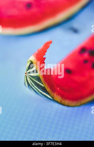Bark of a leftover eaten watermelon slice with seeds Stock Photo