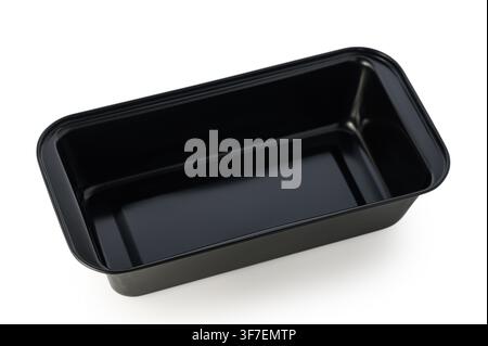 On a clean white background lies a sleek, rectangular black plastic container. Its shiny surface reflects light, showcasing its smooth edges and spaci Stock Photo