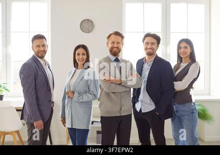Confident business people team, smiling professional coaches group leaders mentors posing together Stock Photo