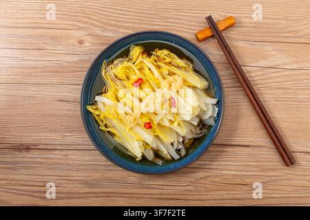 Asian Style Marinated Baby Chinese Cabbage Topped with Chili Peppers Stock Photo