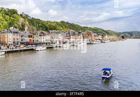 Small electric boat on the Meuse river in Dinant, Belgium Stock Photo