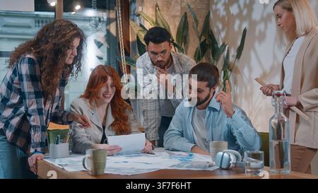 Casual informal business team five people men women working with documents data marketing result discuss in office startup conference brainstorming Stock Photo