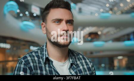 Close-up portrait serious calm confident Caucasian business man looking away thinking male bearded businessman European student guy with bristle Stock Photo