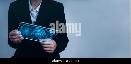 Business professional engineering using tablet with AI robotics control screen for smart manufacturing, industrial automation, digital engineering, fu Stock Photo