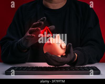 Scammer or hacker stealing victim's savings through financial fraud, cybercrime, online banking fraud, investment scam, identity theft, money theft, d Stock Photo