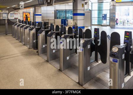 Automatic turnstile barriers at modern metro station entrance. London, UK, 17 March 2024 Stock Photo