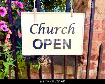A church open sign outside a village church in England, U.K. Stock Photo