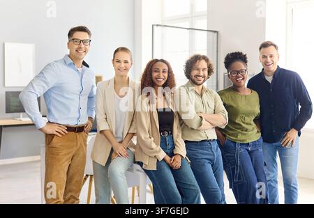 Diverse business team smiling together for corporate office group portrait Stock Photo