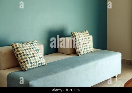 Modern sofa with decorative pillows in a stylish interior Stock Photo