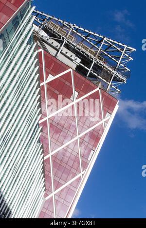 The distinctive red geometric facade of The Nova Building in Victoria, London, a major office and residential development landmark. Stock Photo