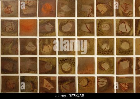 Patterned stone tiles in a square, handmade ceramic tiles, glazed pottery tiles, mosaic wall art Stock Photo