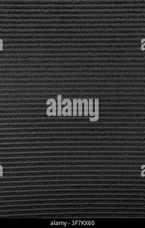 Close-up of textured fabric with fine, horizontal woven threads. Dark, neutral tones create a modern, minimalist aesthetic. Ideal for backgrounds, des Stock Photo