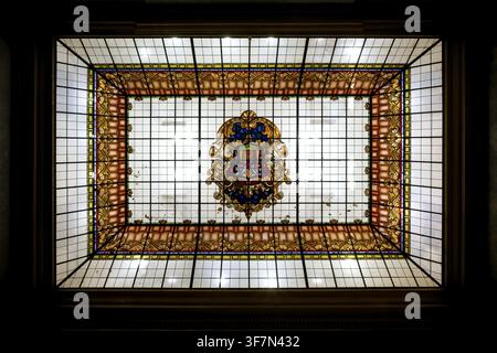 Stained glass ceiling with decorative coat of arms and geometric shapes in bold colors, Ajuntament d'Alcoi, Alcoi Town Hall, Modernism, Catalan and Va Stock Photo