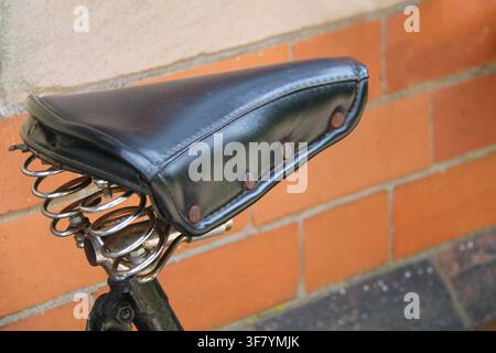 An Old Fashioned Leather Sprung Bicycle Saddle Seat. Stock Photo
