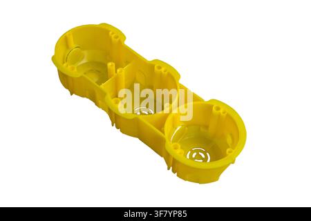 yellow box with three openings for socket and switch isolated on white background Stock Photo