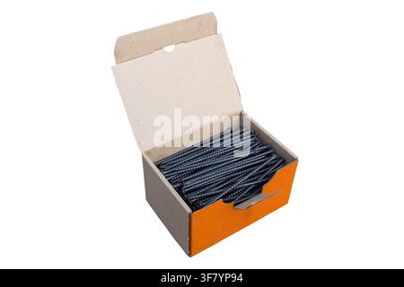 Black screws in a box of cardboard isolated on a white background Stock Photo