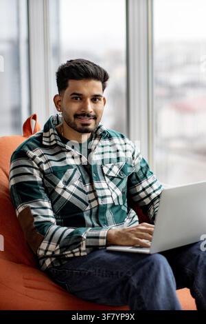 Young Man Working on Laptop Stock Photo