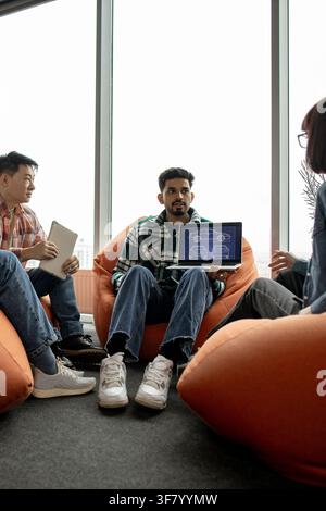 Team Discussing Car Design Blueprint Stock Photo