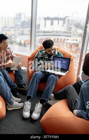 Team Discussing Car Design Blueprint Stock Photo