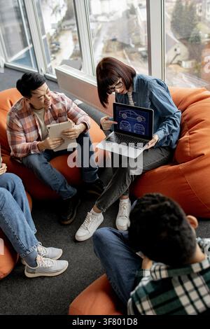 Team Discussing Car Design Blueprint Stock Photo