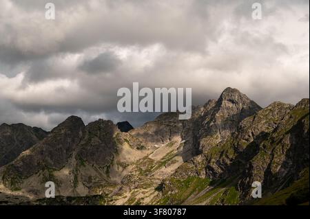 Rocky mountain peaks under a dramatic sky Stock Photo